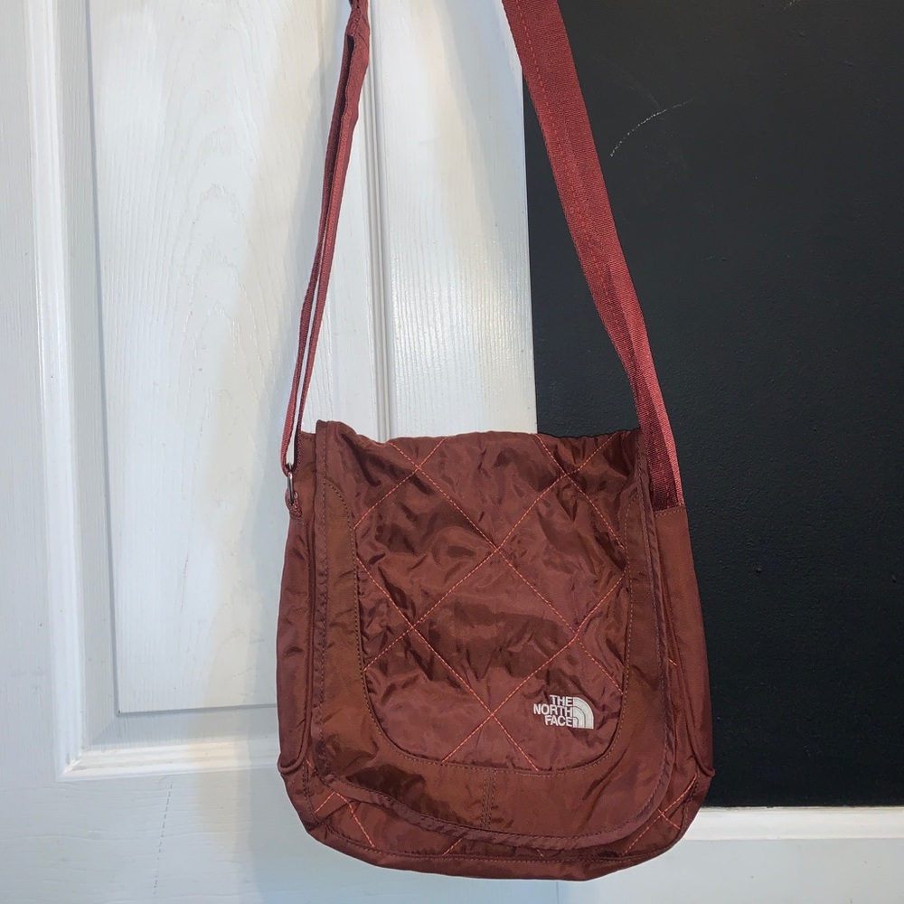 North face shoulder bag with adjustable straps.